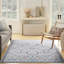 Tapis oriental ivoire et bleu tissé à la machine 6 pi x 9 pi
