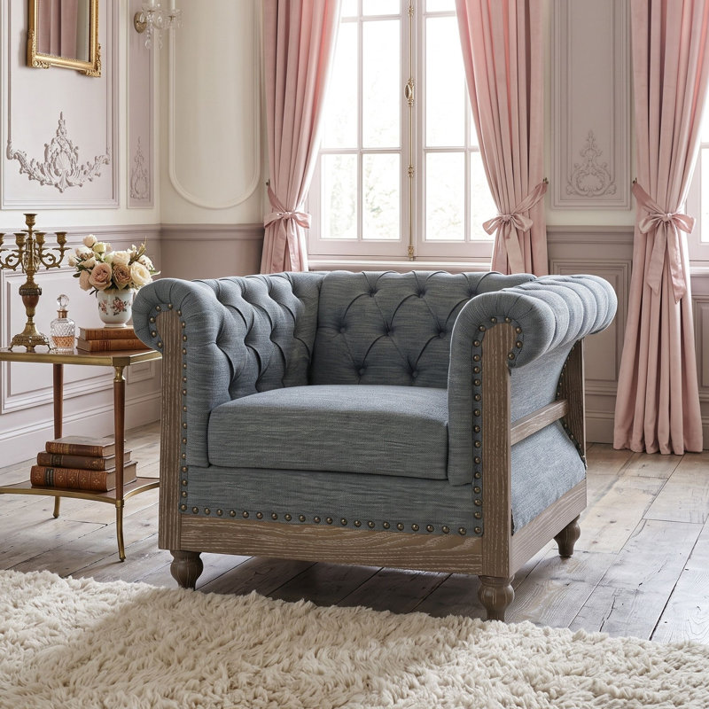 Fauteuil club capitonné d'inspiration Chesterfield avec accoudoirs