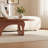 Modern Walnut Oval Coffee Table with Sculptural Arch Base