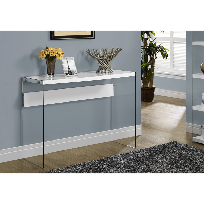 Console de chambre blanche lustrée avec plateau en verre transparent, apportant une touche contemporaine à la chambre. Plateau moderne et éléments en verre, idéal pour les entrées.