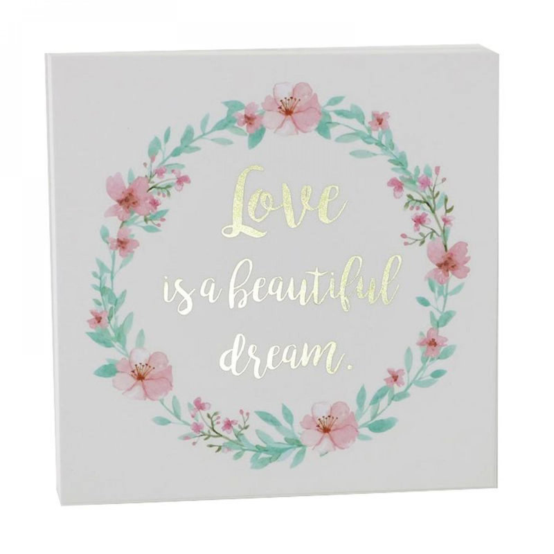 Couronne florale avec texte «Love Is A Beautiful Dream Block»