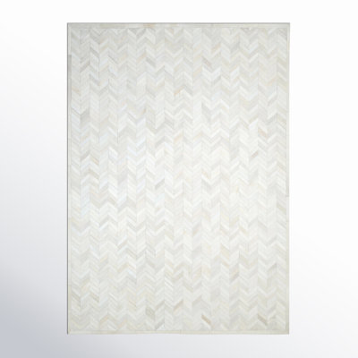 Tapis ivoire en cuir de vache Azikiwe