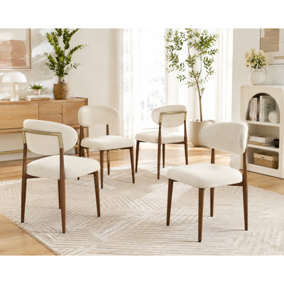 Modern minimalist 4-piece dining set featuring breathable, fine-textured beige linen upholstery and walnut-colored metal legs; the chairs are constructed with a metal frame and plush memory foam padding.