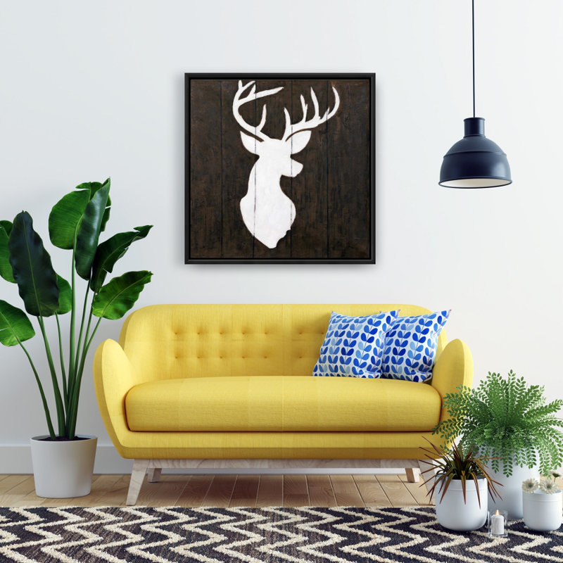 "Silhouette blanche d'un cerf sur bois"