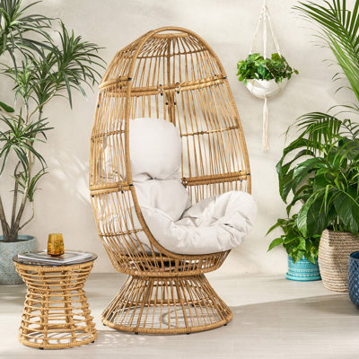 Brown Egg Chair With Cushion. Cozy Basket Style. . Water- Padding. 27.43" D X 29.95" W 57.21" H. Handmade Details. Assembly Required Swivel Comfort Shape Design. Construction. Upholstery. 27.43"d