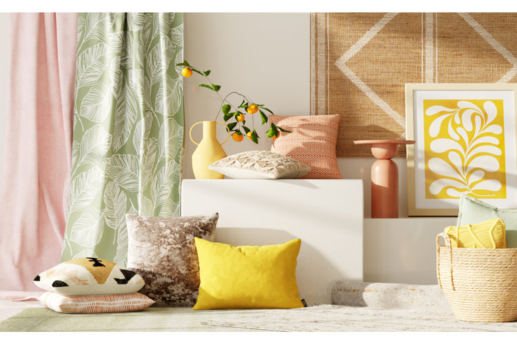 Decor scheme with curtains, throw pillows, vases, artwork, and rugs.