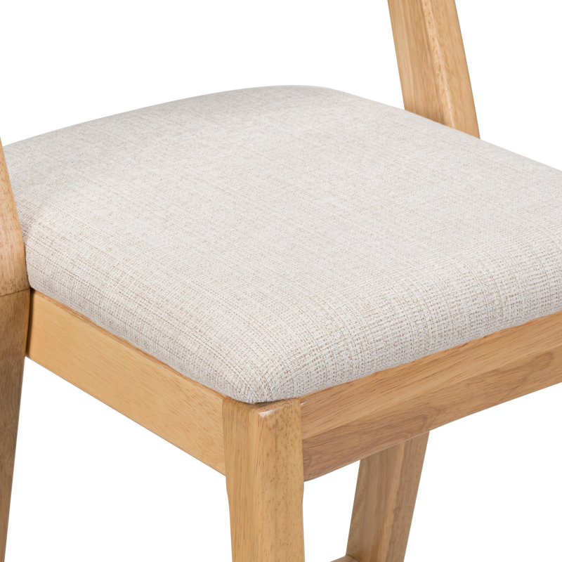 De 2 coussins en bois d'hévéa fabriqués à l'intérieur avec une finition naturelle et un coussin en tissu beige, une assise ergonomique et confortable, une structure stable pour une utilisation sécuritaire avec une finition, un revêtement, un confort de coussin et des pieds