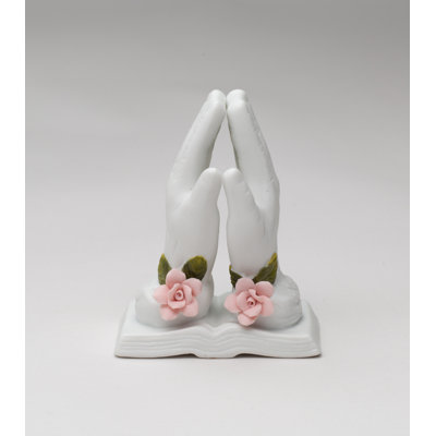 Figurine priant avec une rose