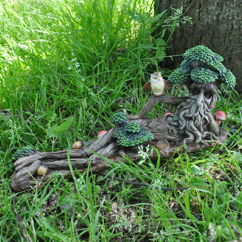 Laursen Lying Down with Owl Statue