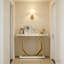 Console luxueuse avec plateau en faux marbre et base dorée