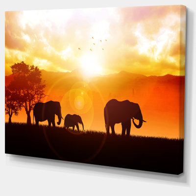 " Elephants Walking At Sunset "
