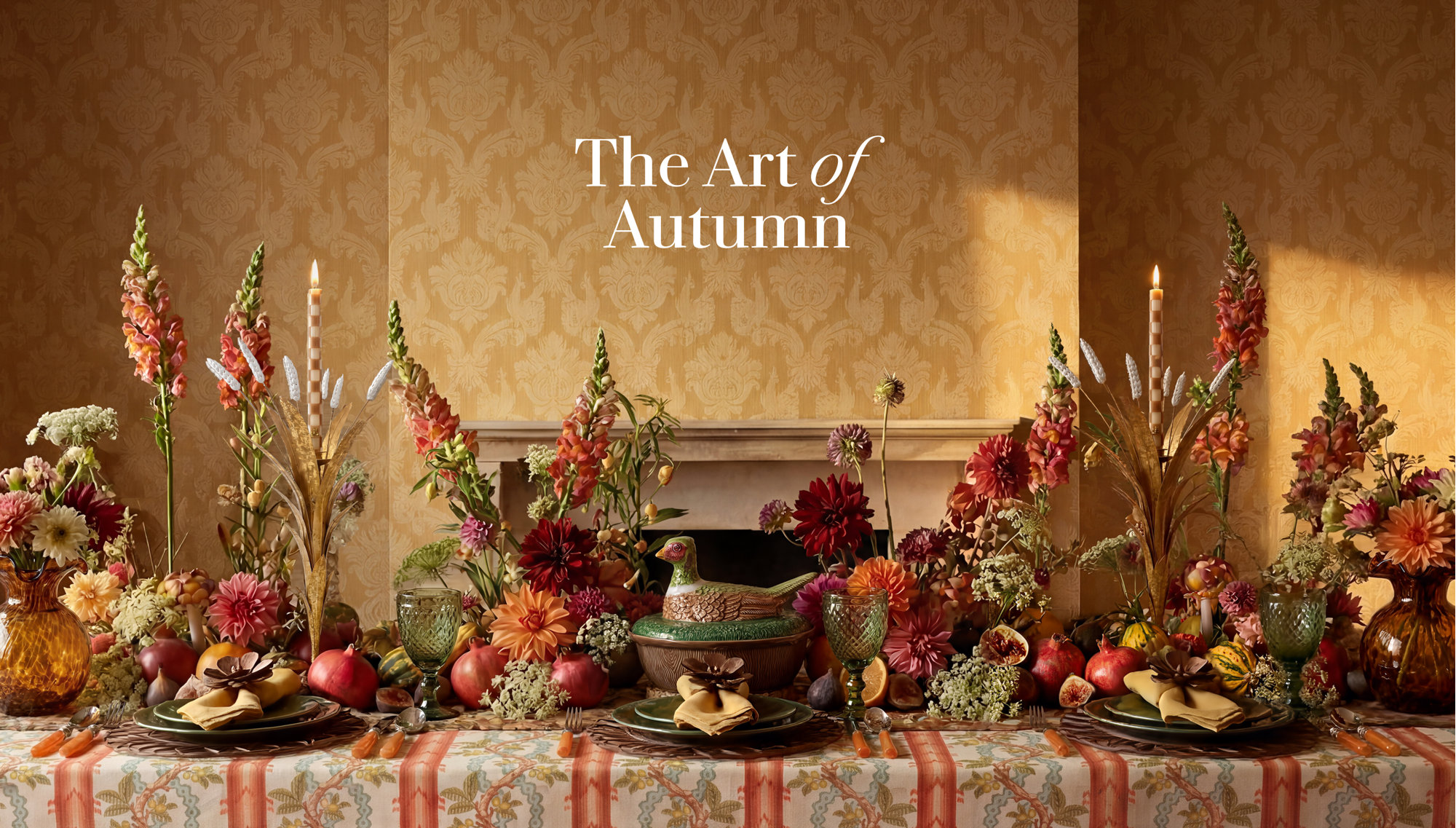 The Art of Autumn table setting features a pheasant-shaped tureen, vibrant dahlias, snapdragons, pomegranates, and patterned linens against a gold damask wallpaper backdrop.