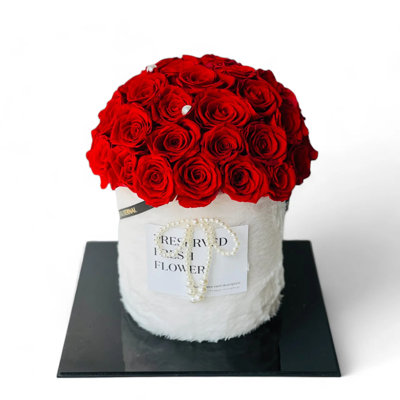 Arrangement floral rose en boîte