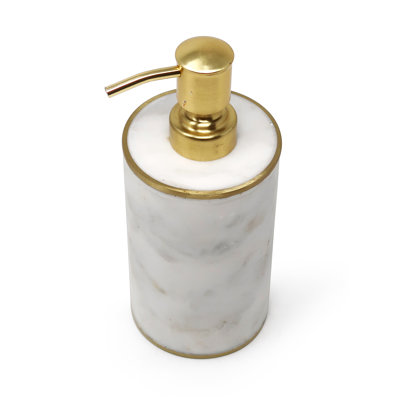 Distributeur en marbre blanc avec pompe dorée