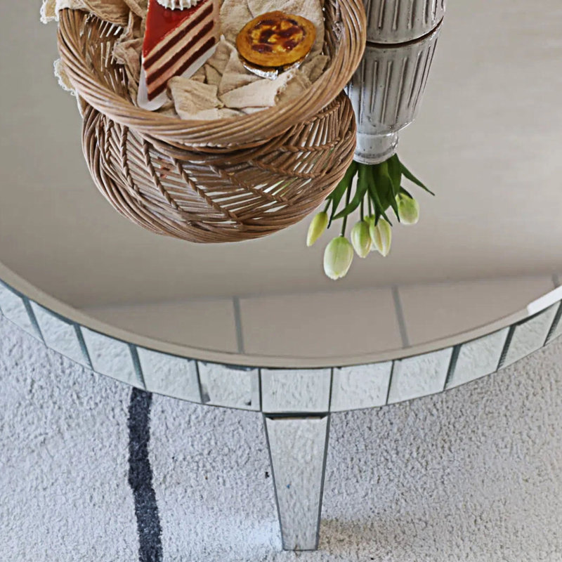 Table de salle à manger ronde avec miroir en forme d'étoile