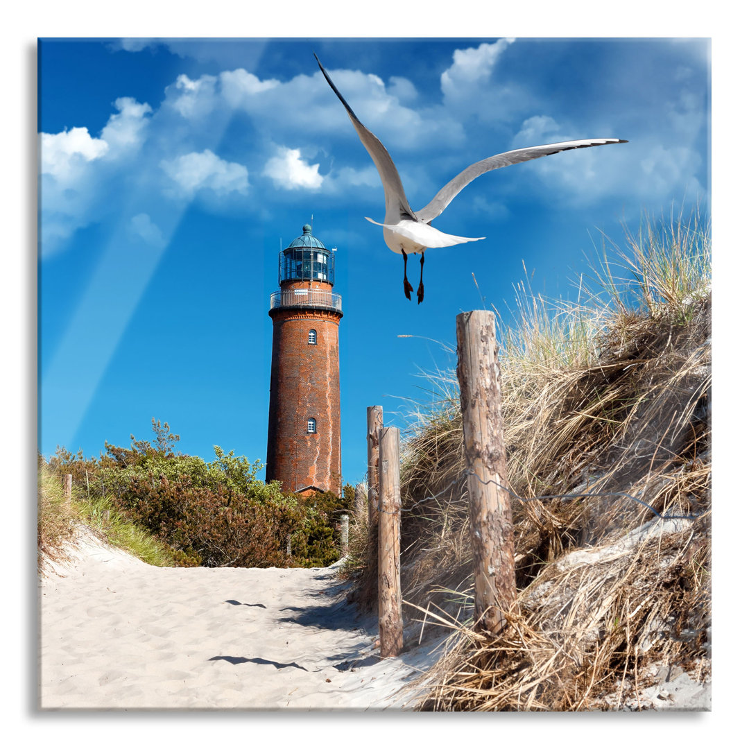 Glasbild Schöner Leuchtturm am Strand