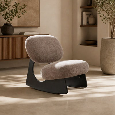 Fauteuil à bascule sans accoudoirs, revêtu de chenille douce au toucher, avec un piètement creux sculptural unique, idéal pour le salon, la chambre ou la chambre d'enfant.