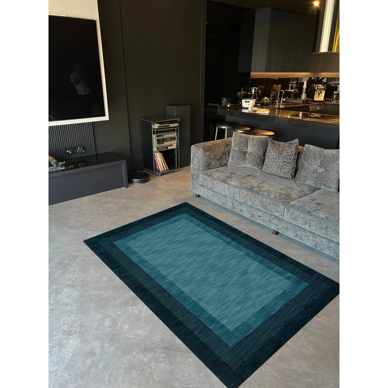 Tapis en polypropylène à motif géométrique de couleur turquoise et bleu marine à motif géométrique