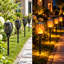 Lampes de poche solaires d'extérieur avec 96 DEL à effet flamme dansante, résistantes aux intempéries, pour l'éclairage des allées de jardin.