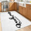 Tapis d'intérieur blanc lavable à la machine, avec inscription « Bonne année » à la main.-752461143