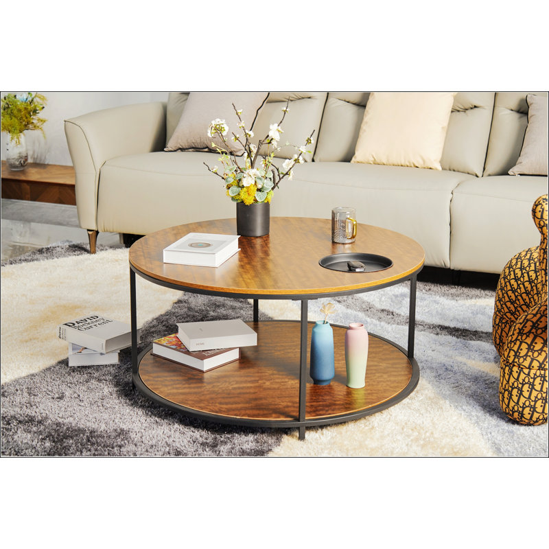 Table basse ronde en bois antique avec deux supports et plateaux de rangement, parfaite pour les salons modernes et fonctionnels.