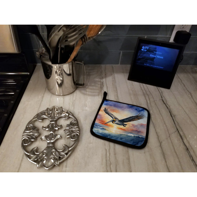 Paire de porte-casseroles Pelican Fyling au lever du soleil
