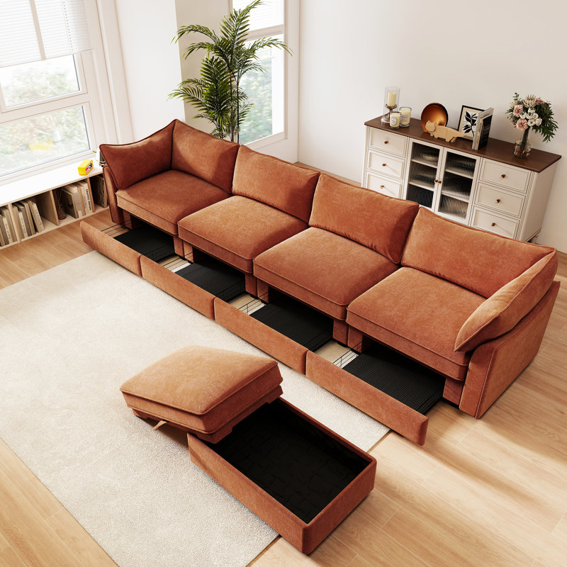 4 sièges orange en chenille avec dossier modulaire et accoudoirs escamotables, avec coussins enveloppants et tiroirs de rangement