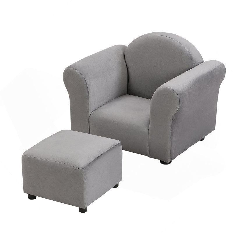 Canapé rembourré pour enfants avec repose-pieds, une option de siège confortable et durable pour que les petits puissent se détendre et jouer.