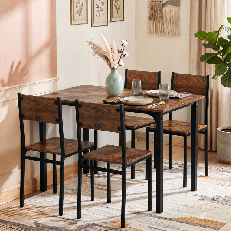 Ensemble de salle à manger 5 pièces pour 4 personnes, table et chaises de cuisine de style industriel avec structure métallique robuste, comprenant 1 table rectangulaire et 4 chaises à dossier haut.