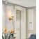 Bilbo Frame 1 Light Gold Arm Sconce With A Glass Shade