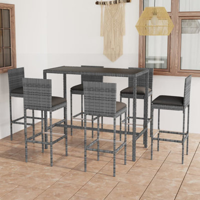 Haridutt 6 - Person Patio Dining Set Rectangular Table with Cushions Included
