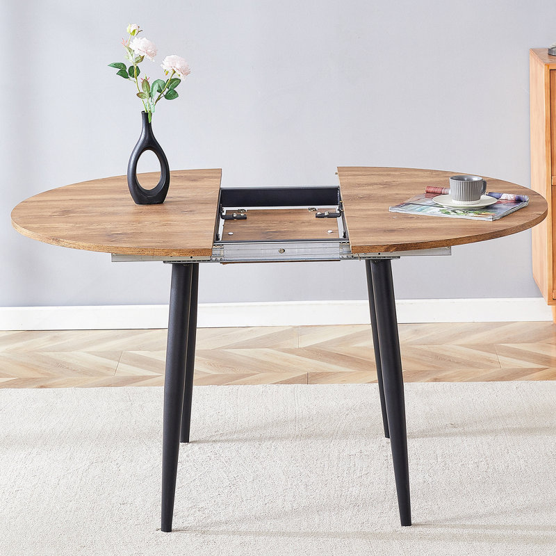 Avec un mécanisme rétractable astucieux, le plateau de table en bois aggloméré et les pieds en métal noir ont une surface lisse et délicate. Le look unique crée la silhouette élégante d'une maison moderne.