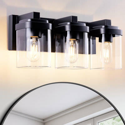 3 - Applique murale noire mate avec abat-jour en verre transparent, idéale pour les escaliers, les entrées et les salles de bain. Finition en verre, entièrement précâblée, installation facile.
