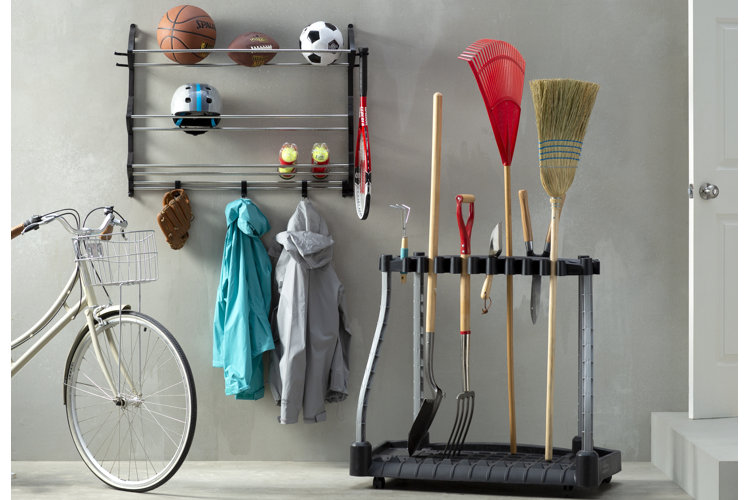 sports rack and tool rack in an organized garage