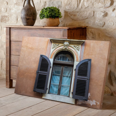 Canvas A Weathered Ornate Window Framed By Intricate Stonework Featuring Dark Wall Art Wooden Shutters Adorned With Delicate Carvings Canvas Wall Art