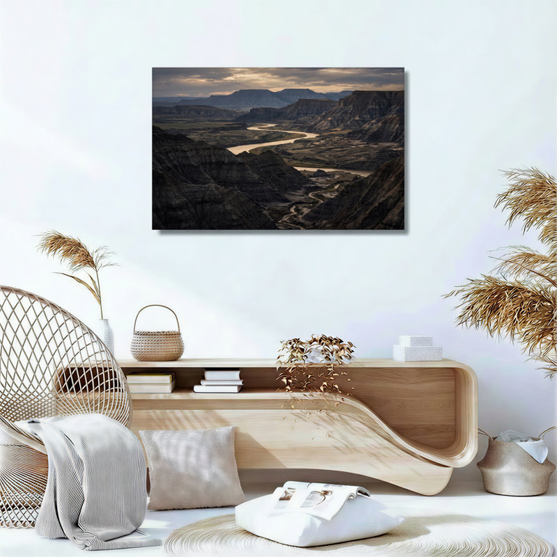 «Winding River Through Rugged Badlands Under Cloudy Sky», art mural, H 36 po x l 48 po