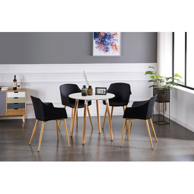 Topsham 4 Person Dining set - a Round Plastic Dining Table with Wooden Legs and a Set of 4 Faux Leather Cushion Padded Dining Chairs for Dining Room - Modern Dining Table Set