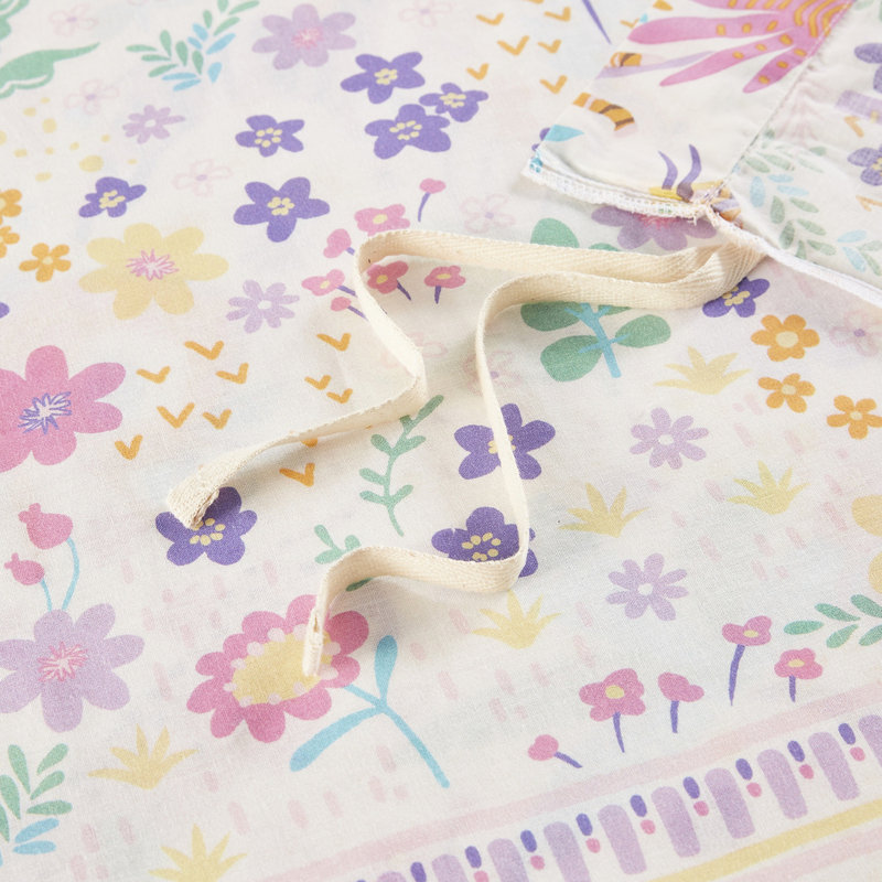 Housse de couette réversible multicolore pour lit simple, à motifs floraux et animaliers, en coton coloré.