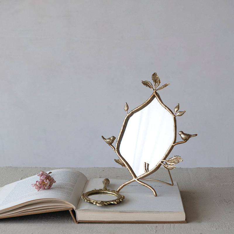Miroir à main encadré en métal embossé
