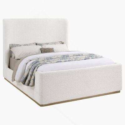 Lit-bateau tapissier luxueux avec base en bois exposée offrant confort, style et durabilité pour une chambre à coucher relaxante