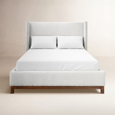 Abrahamsville Upholstered Wingback Solid Wood Bed Frame