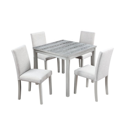 Élégante table de salle à manger gris argentée avec 5 pièces, y compris des sièges rembourrés ergonomiques et des sièges confortables en bois