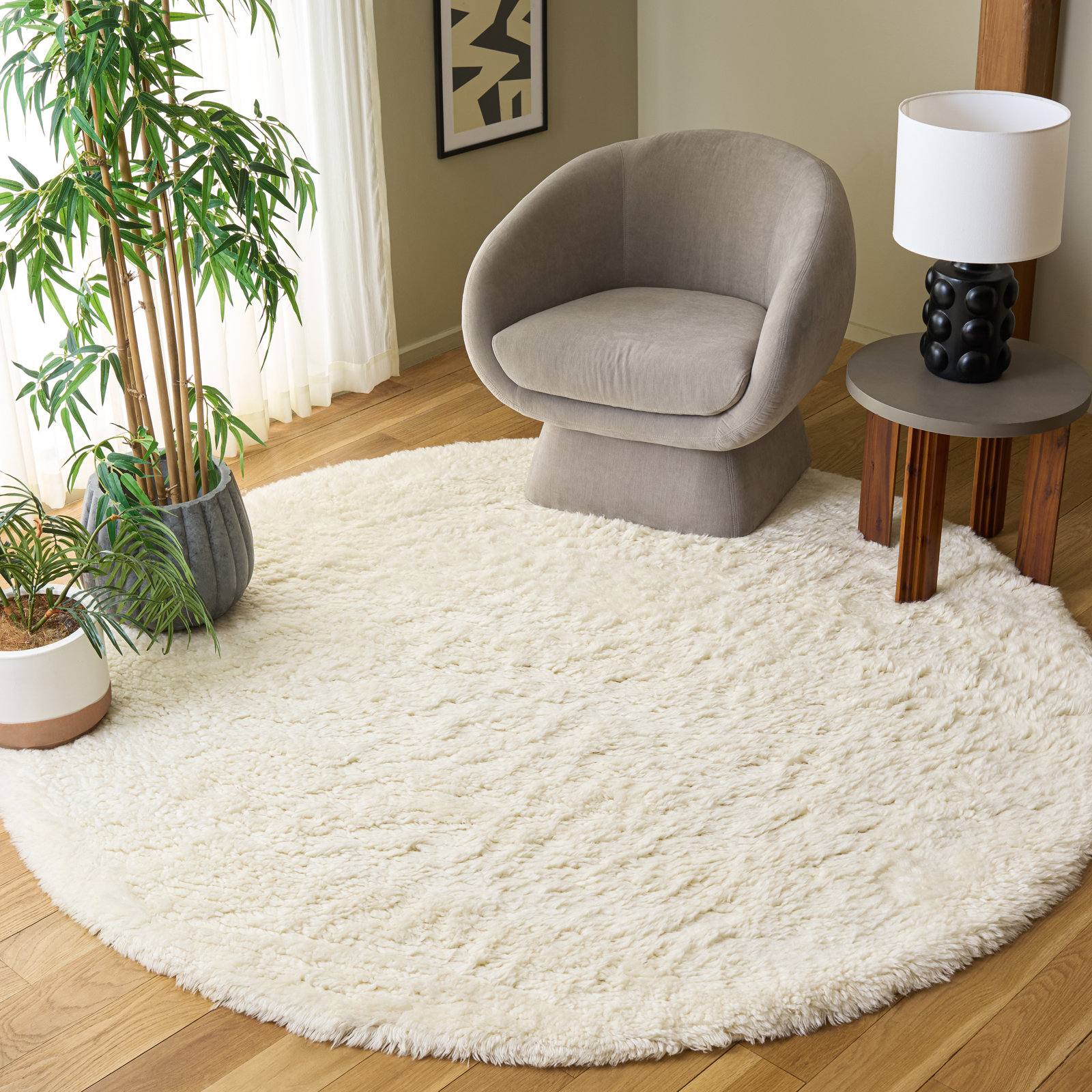 Abriel Ivory Solid Hand-Woven Wool Rug, Round 7'