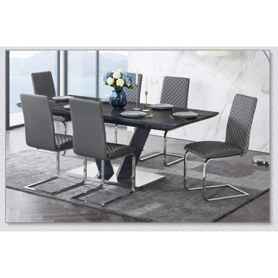 Table de salle à manger extensible moderne en pierre frittée avec pied central chromé en forme de V pour mobilier de salle à manger de luxe