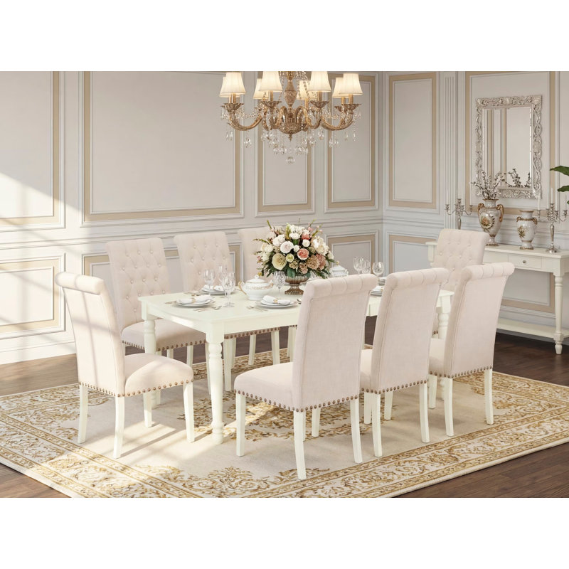 Cet ensemble de salle à manger 9 pièces comprend une table de salle à manger rectangulaire avec feuille papillon et 8 chaises rembourrées en tissu de lin beige clair, lin blanc