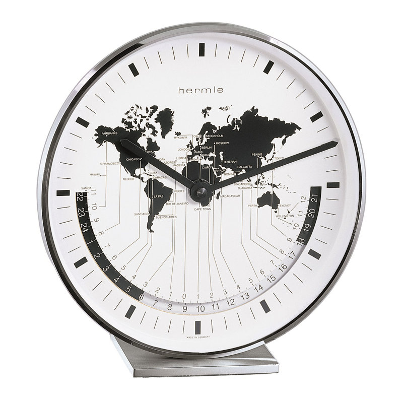 Nickel Plated Table Clock with a Quartz Time Only Movement   Dial features a world map and different time zones.