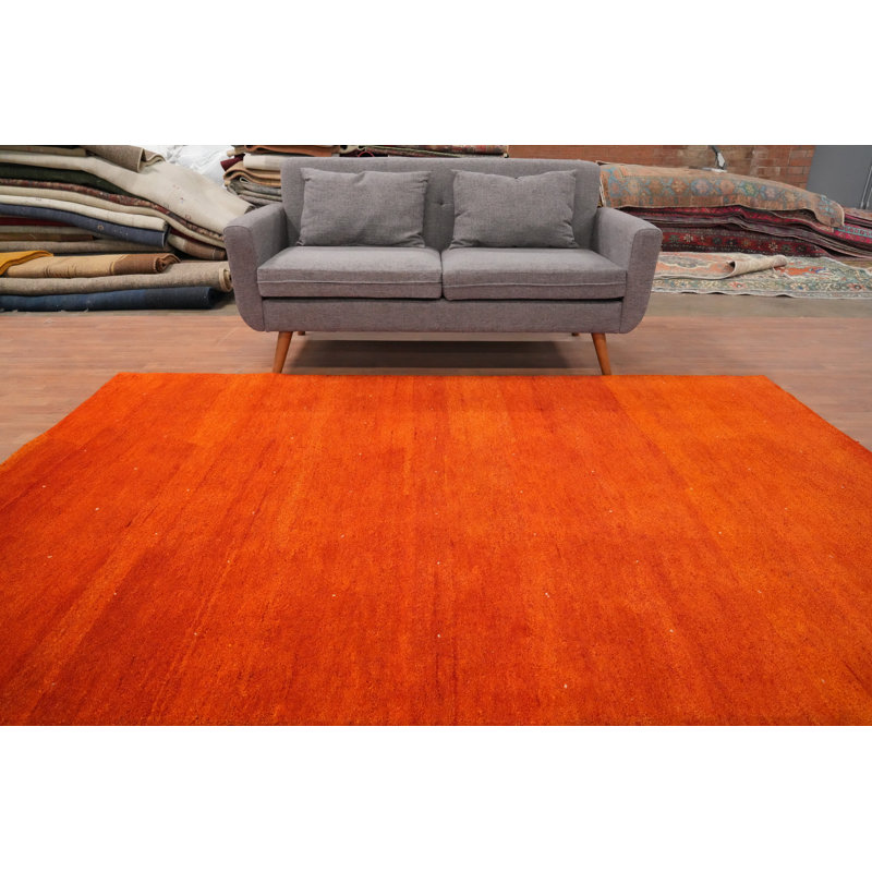 Le tapis 6 x 9 Bold Tangerine Hues Gabbeh transforme instantanément n'importe quelle pièce
