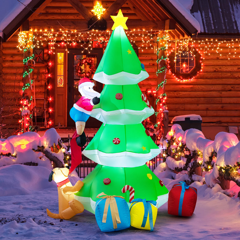 Arbre avec père Noël et chien gonflable