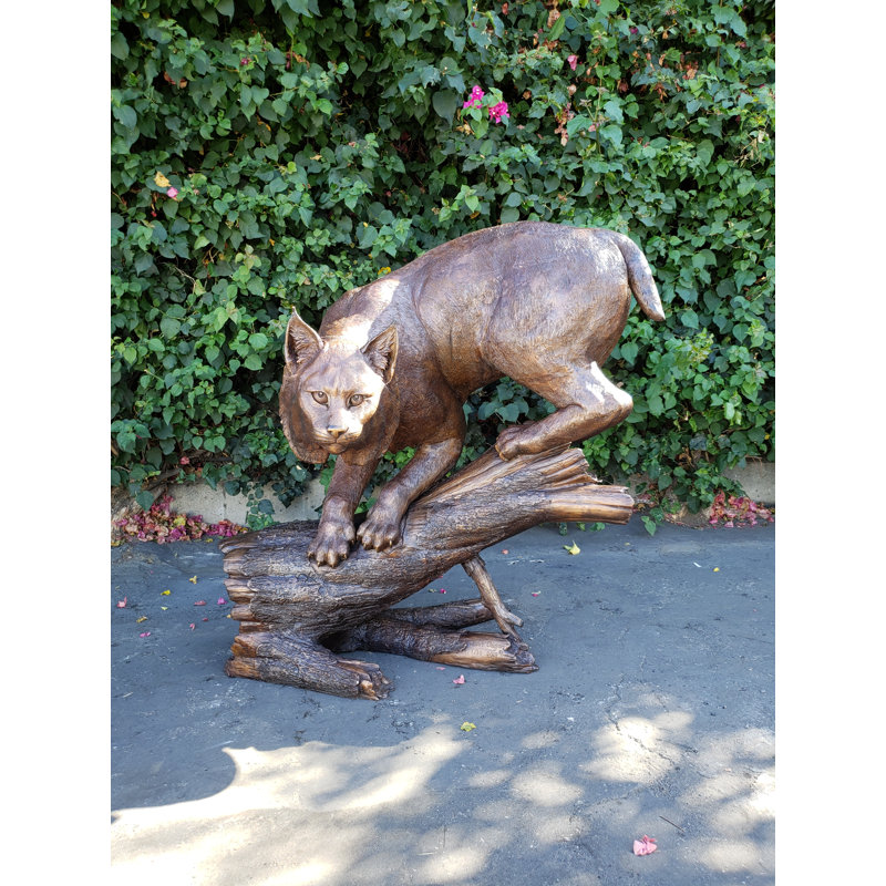 Bobcat Going Down a Tree Log Bronze Statue -  Size: 43"L x 25"W x 41"H. 