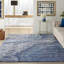 Tapis bleu abstrait touffeté-537889654